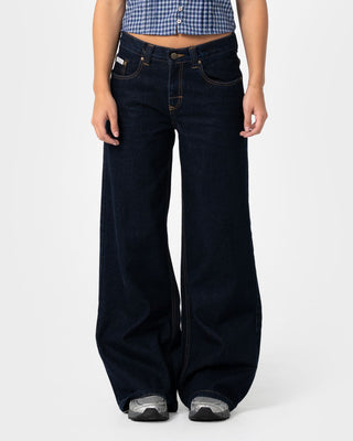 Woman wearing Wendy Wide Low Rise Denim Jean in Raw Dawg