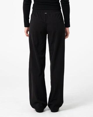 Woman wearing Bronson Low Rise Trackpant in Black