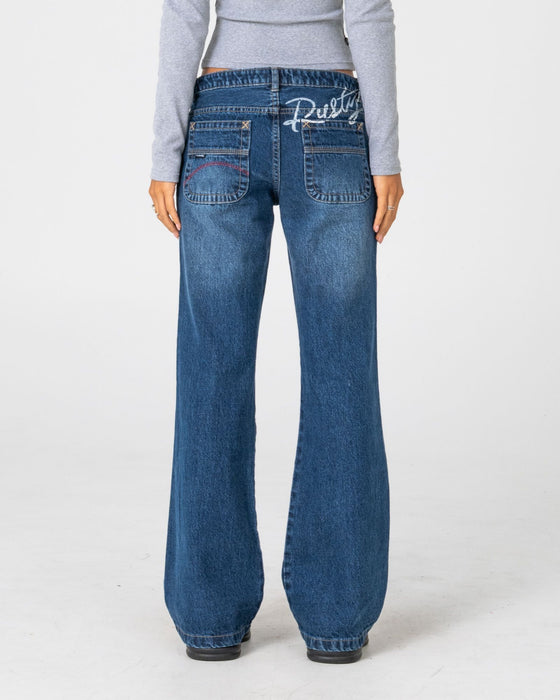 woman-wearing-shorty-freida-flare-low-rise-jeans-in-blasted-deep-sea-blue