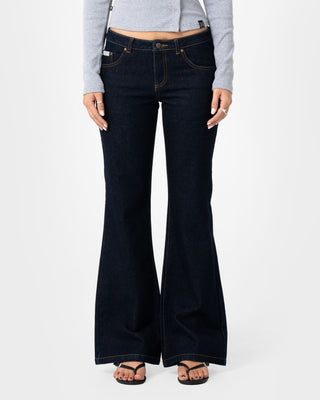 Woman wearing Freida Flare Low Rise Jeans in Raw Dawg Blue