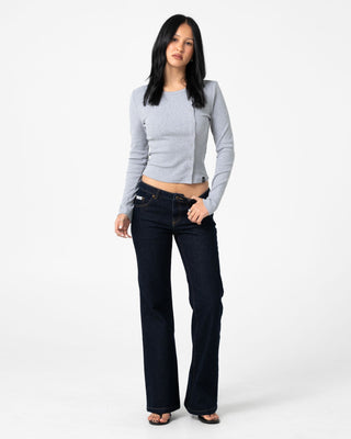 Woman wearing Freida Flare Low Rise Jeans in Raw Dawg Blue