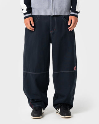Man wearing Step-stone Cacoon Pant in Navy Blue