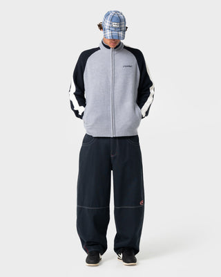 Man wearing Step-stone Cacoon Pant in Navy Blue