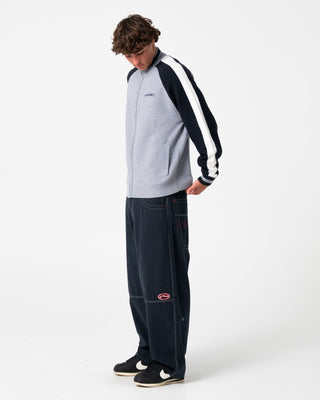 Man wearing Step-stone Cacoon Pant in Navy Blue