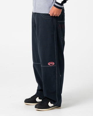 Man wearing Step-stone Cacoon Pant in Navy Blue