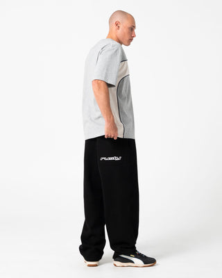 Man wearing Gainer Baggy Track Pant in Black