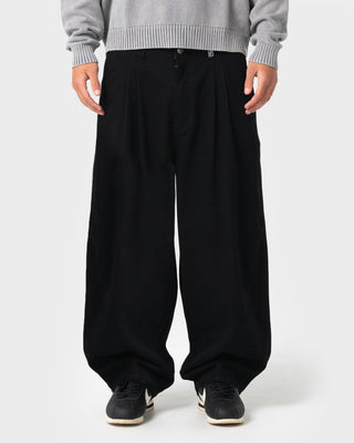 Man wearing Enigma Pleated Pant in Black