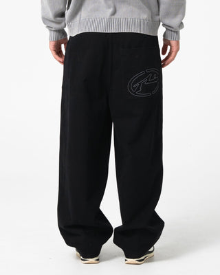 Man wearing Enigma Pleated Pant in Black