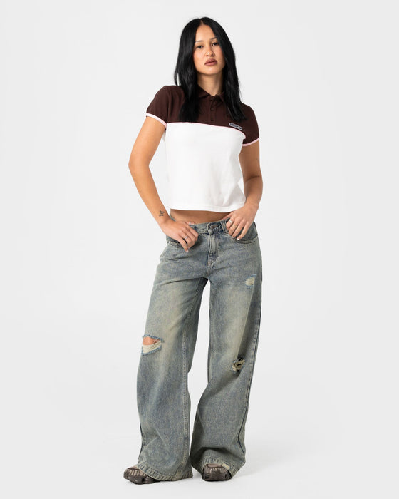 woman-wearing-insert-dad-joke-baby-polo-tee-in-cream-choc