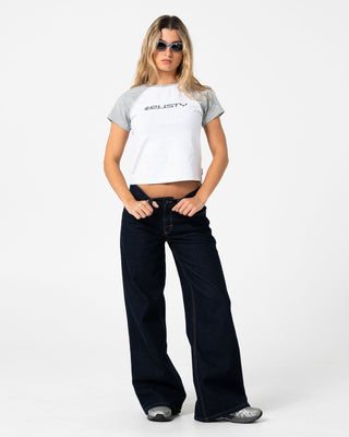 Woman wearing Archived Raglan Baby Tee in Ecru Marle / Grey