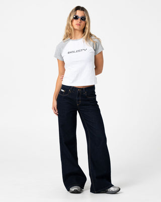 Woman wearing Archived Raglan Baby Tee in Ecru Marle / Grey