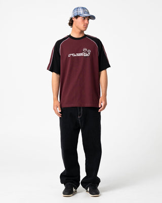 Man wearing Omac Short Sleeve Tee in Burgundy