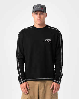 Man wearing Chuck No Worries Long Sleeve Tee in Black