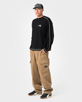 Man wearing Chuck No Worries Long Sleeve Tee in Black