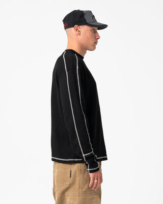 Man wearing Chuck No Worries Long Sleeve Tee in Black