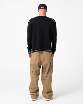 Man wearing Chuck No Worries Long Sleeve Tee in Black