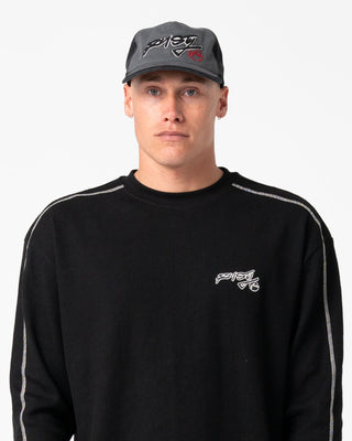 Man wearing Chuck No Worries Long Sleeve Tee in Black