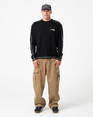 Man wearing Chuck No Worries Long Sleeve Tee in Black