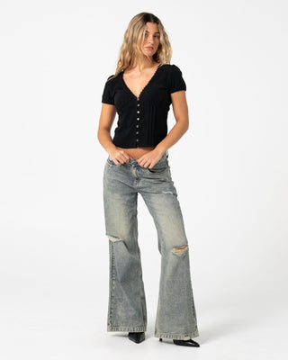 Woman wearing Peggy Sue Button Down Blouse in Black