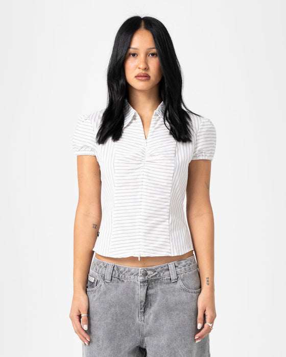 woman-wearing-horizon-zip-through-short-sleeve-shirt-in-mono-stripe