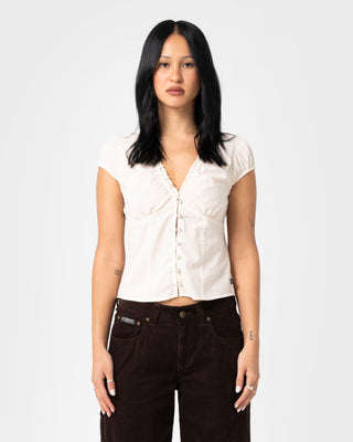 Woman wearing Dakota Short Sleeve Shirt in Cream