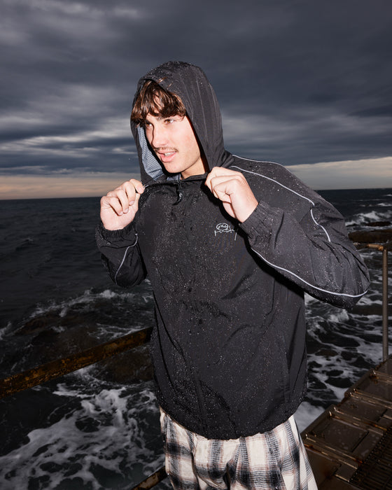 man-wearing-scyther-rain-jacket-in-black