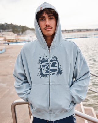 Man wearing Revolt Waffle Zip Thru Hooded Fleece in Sky Blue