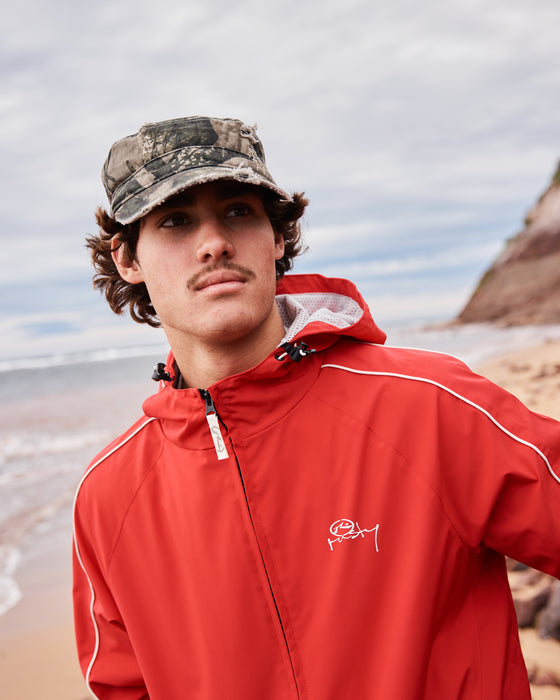 man-wearing-scyther-rain-jacket-in-vintage-red
