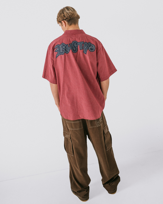 man-wearing-ransom-check-short-sleeve-shirt-in-burgundy