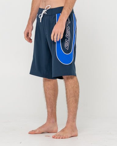 Man wearing Charger Boardshort in Navy Blue / Royal Blue