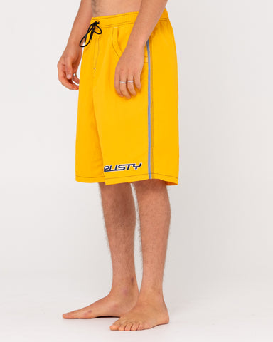 Man wearing Flip Daddy Boardshorts in Gold Fusion