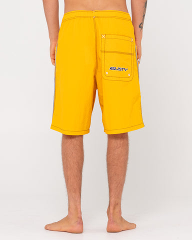 Man wearing Flip Daddy Boardshorts in Gold Fusion