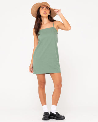 Woman wearing Sweet Water Mini Dress in Sage Leaf