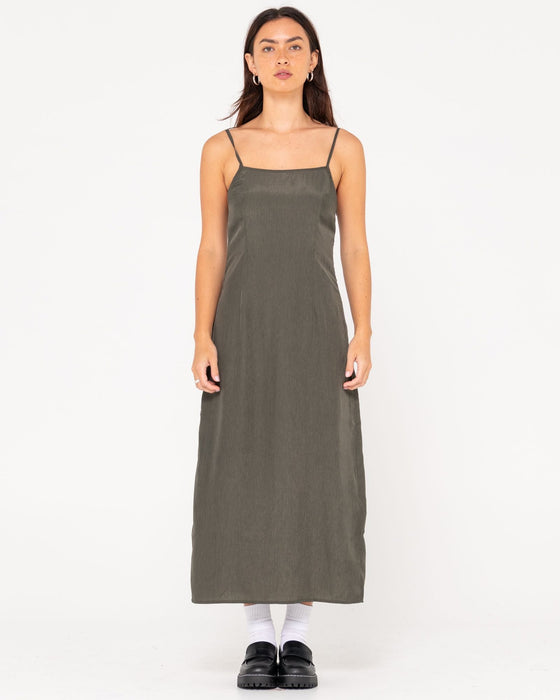 woman-wearing-porter-midi-dress-in-sage-leaf