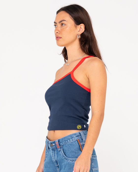 woman-wearing-sling-one-shoulder-contrast-skimmer-tank-in-navy