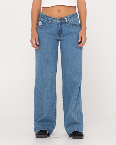 Woman wearing Super Low Rise Wide Leg Denim Jean in Sea Blue