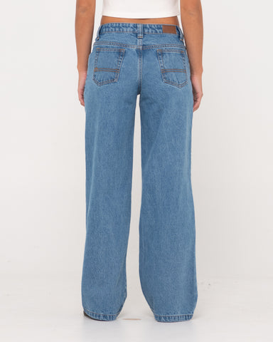 Woman wearing Super Low Rise Wide Leg Denim Jean in Sea Blue