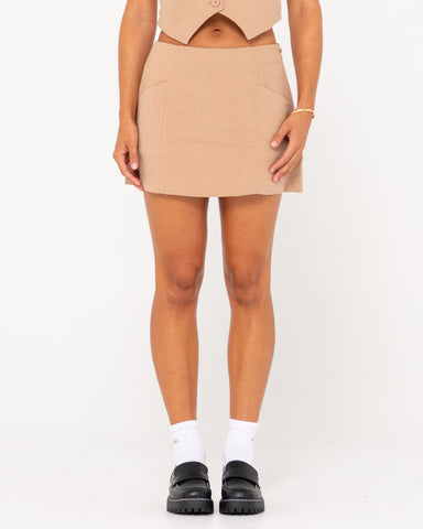 Woman wearing Sicily Mid Rise Skirt in Oatmilk