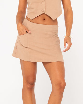 Woman wearing Sicily Mid Rise Skirt in Oatmilk