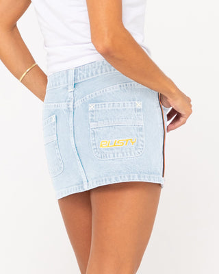 Woman wearing Flip Mommy Low Rise Mini Denim Skirt in Sky Blue Heather/Red Gold