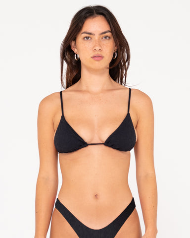 Woman wearing Sandalwood Slick Triangle Bikini Top in Black