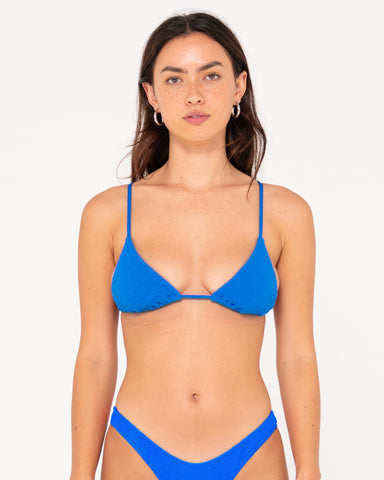 Woman wearing Sandalwood Slick Triangle Bikini Top in Windsor Blue