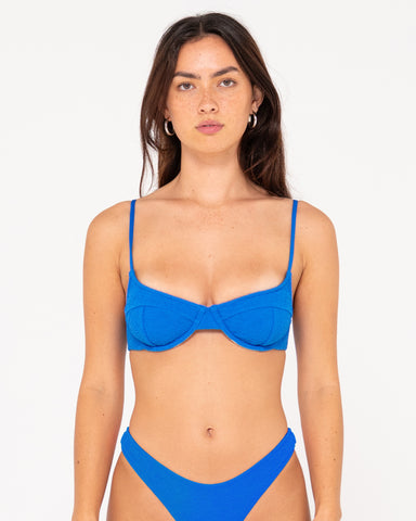 Woman wearing Sandalwood Balconette Bikini Top in Windsor Blue