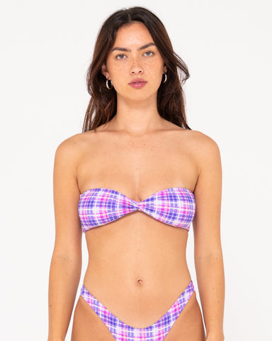 Woman wearing Checked Out Twist Bandeau Bikini Top in Purple Nights