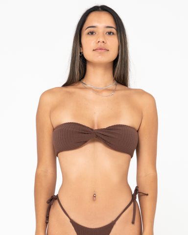 Woman wearing Lucky Twist Bandeau Bikini Top in Java