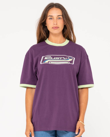 Woman wearing Boarding Pass Oversize Short Sleeve Tee in Purple Rain