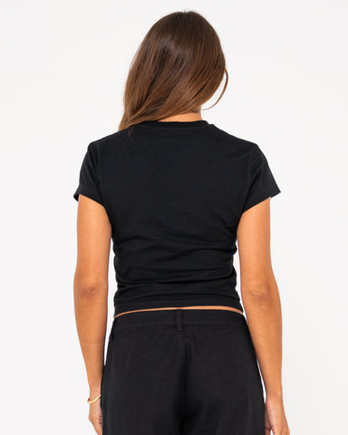 Woman wearing Var-city Short Sleeve Skimmer Tee in Black