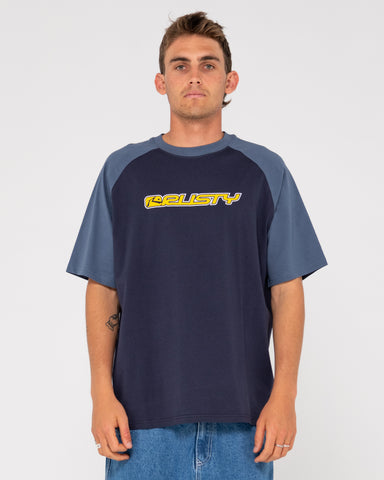 Man wearing Swaglan Raglan Short Sleeve Tee in Navy Blue