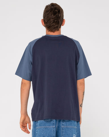 Man wearing Swaglan Raglan Short Sleeve Tee in Navy Blue