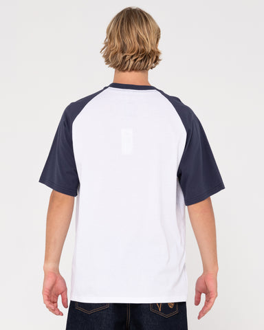 Man wearing Swaglan Raglan Short Sleeve Tee in White / Navy